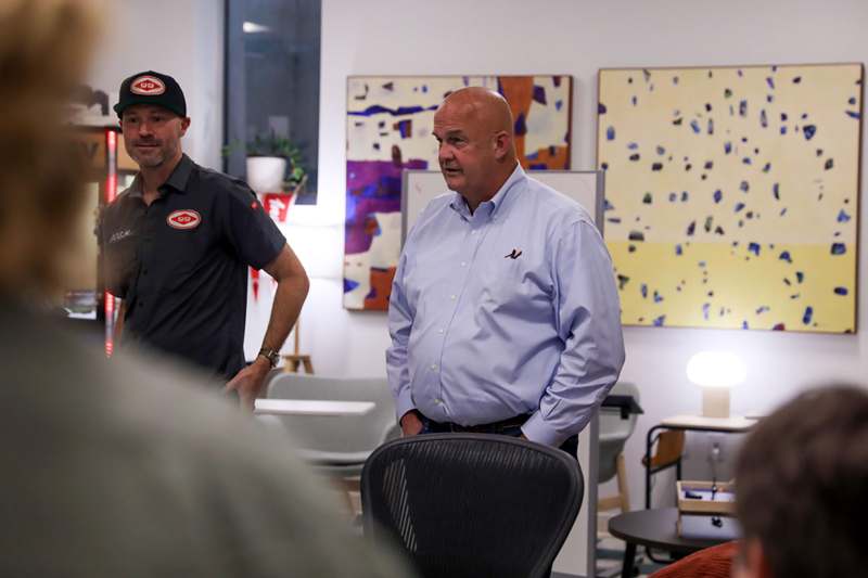 a group of men standing in a room