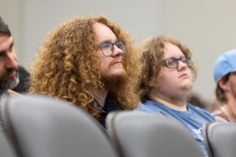 a couple of men sitting in chairs