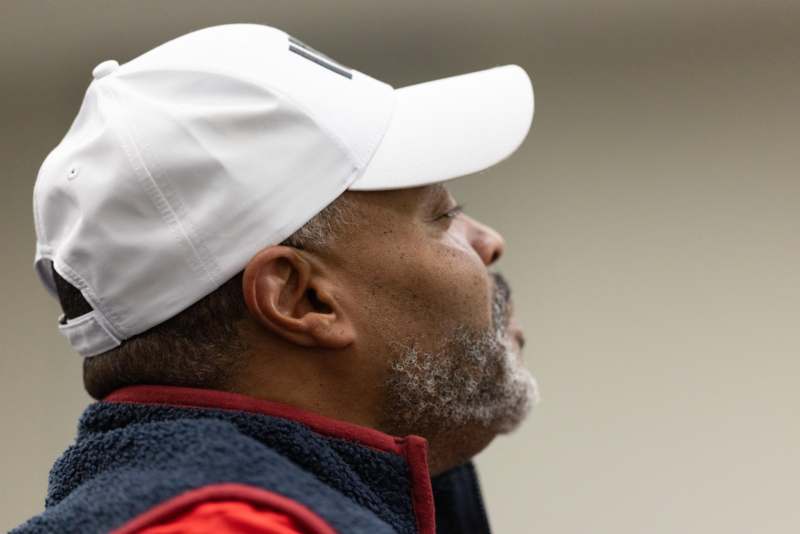 a man wearing a white hat