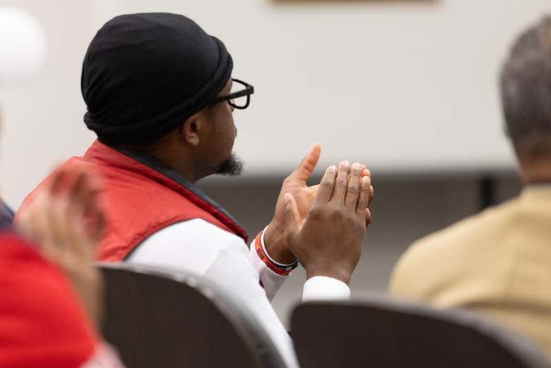 a man clapping his hands