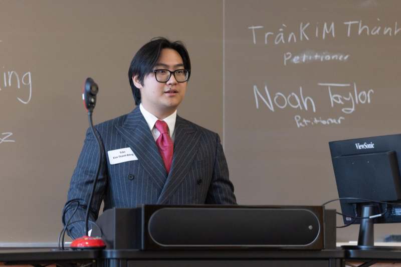 a man standing at a podium