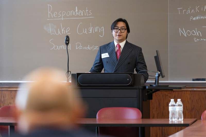 a man standing at a podium