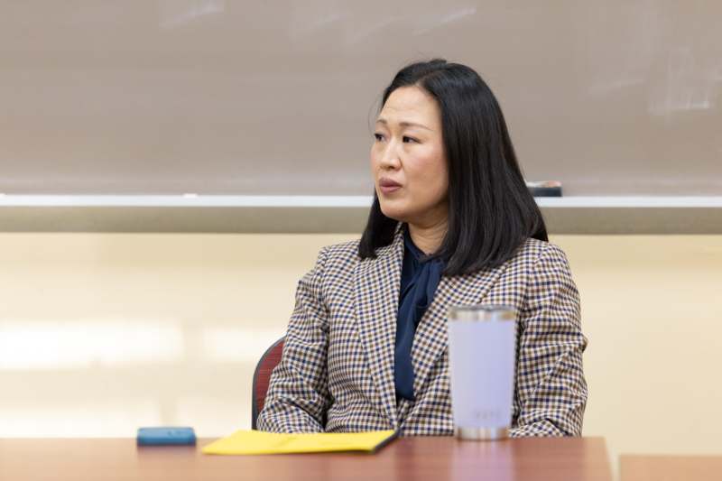 a woman sitting at a desk