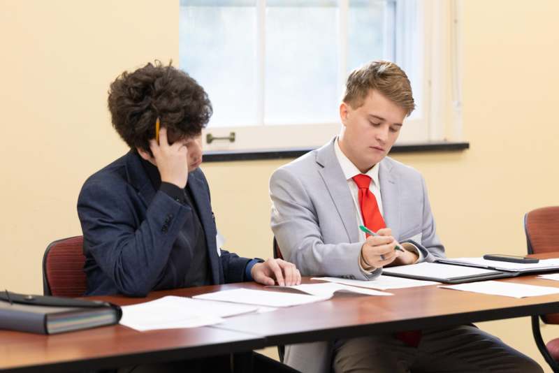 two men sitting at a table