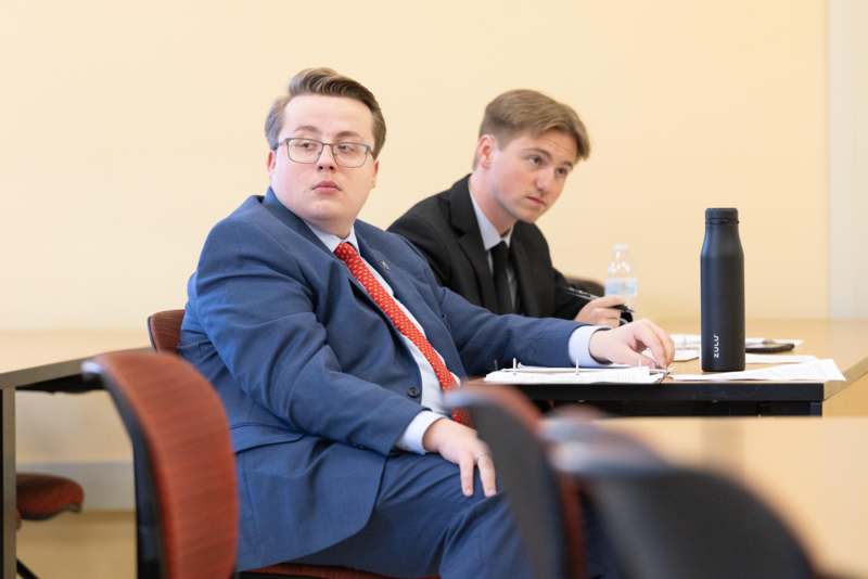 two men sitting at a table
