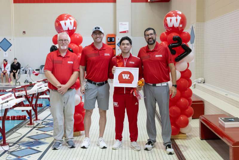 Swimming and Diving Senior Day, 2026 - a group of men standing in a pool