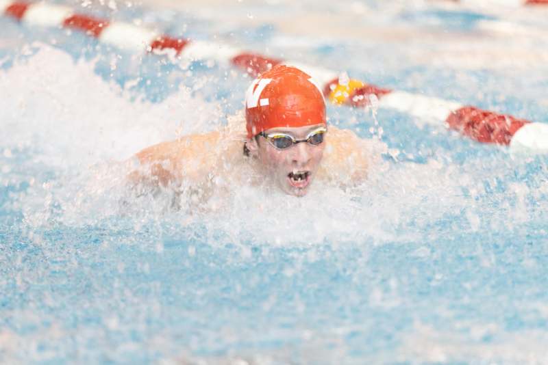 a man swimming in a pool