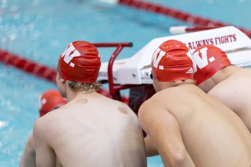 a group of men in swim caps