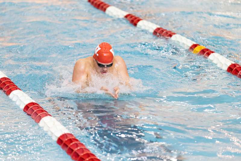 a man swimming in a pool