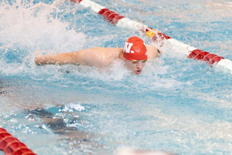 a man swimming in a pool