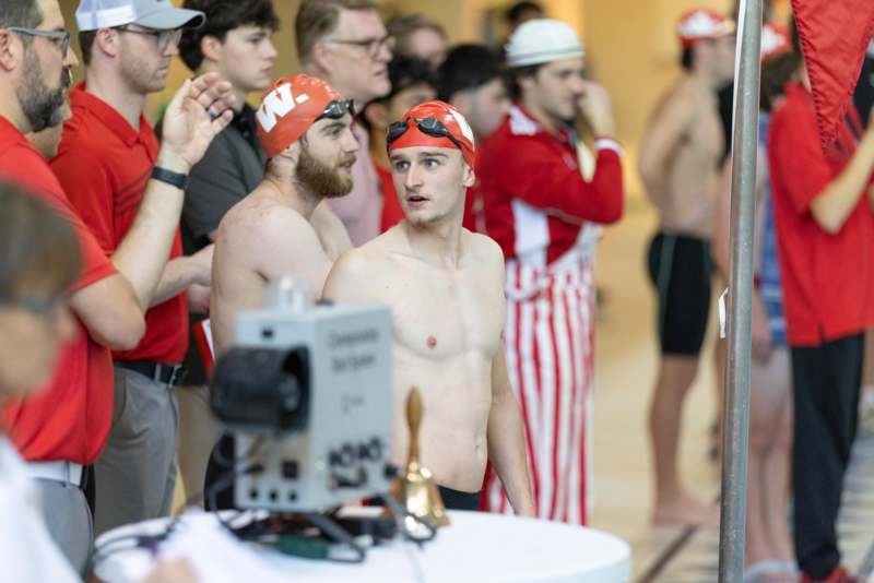 a group of men in swim caps