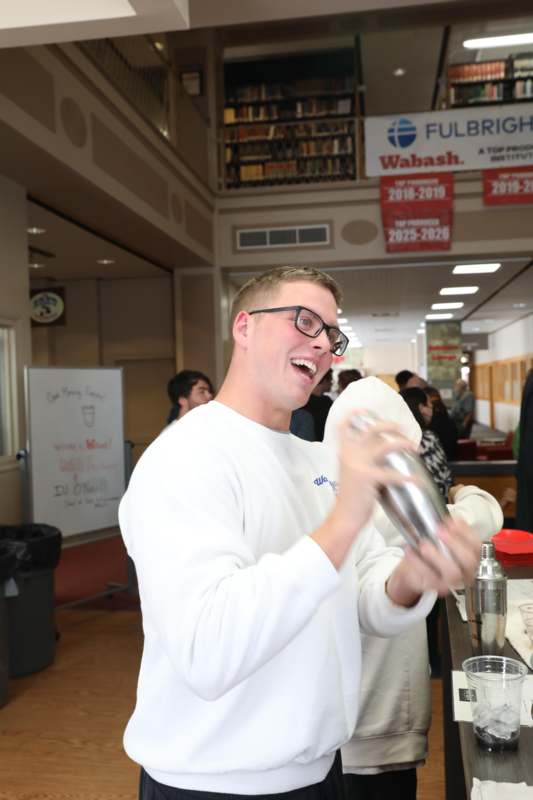 a man holding a shaker