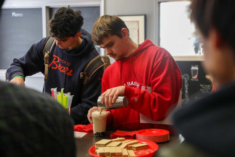 a man pouring milk into a glass