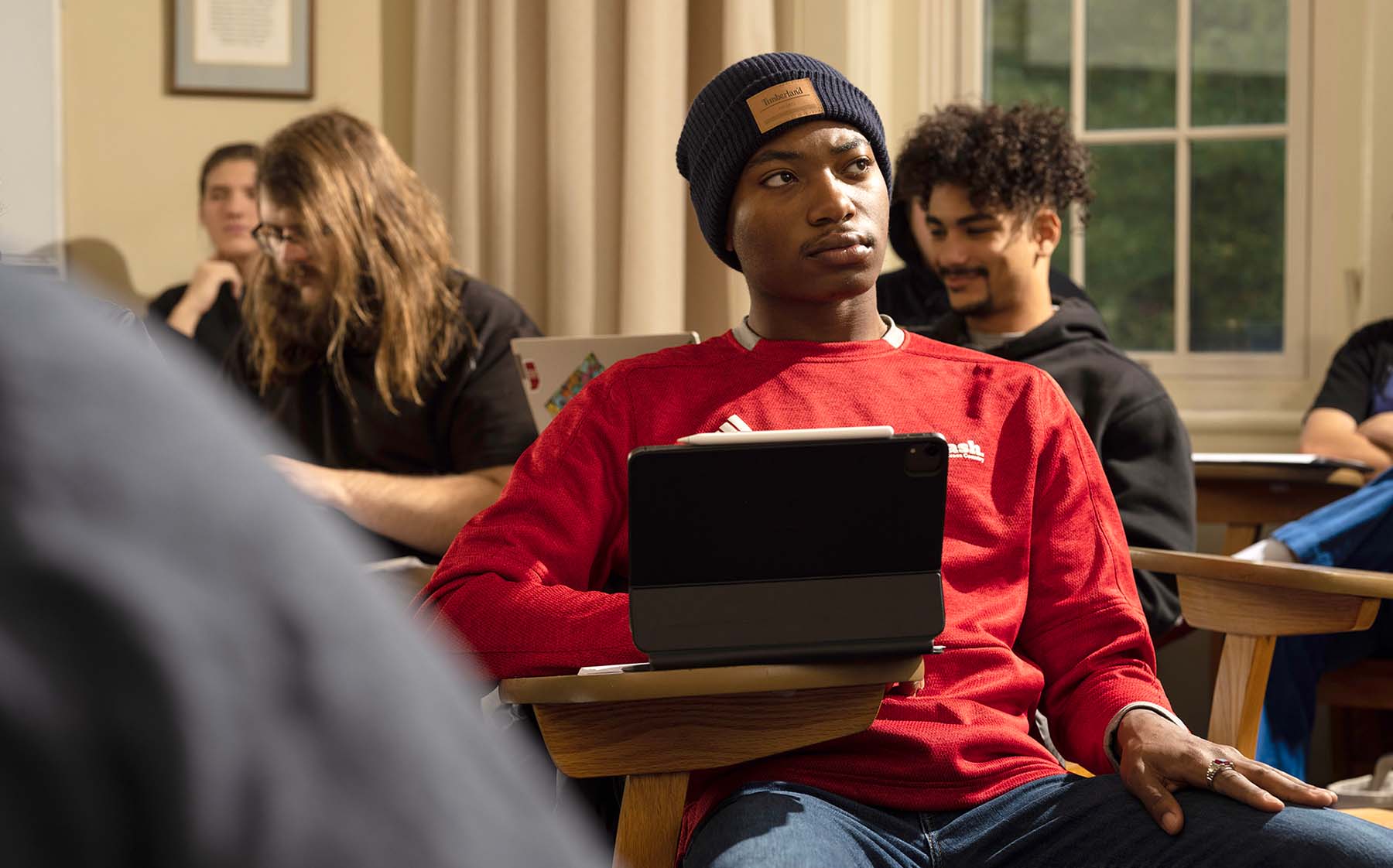 a student at a desk with a tablet
